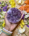 Amethyst works to relieve our minds of worry, stress, or tension. Amethyst helps to remove any mental distractions or clutter. It also strengthens our intuitions and deepens our connection with our higher selves. Amethyst Half-Sphere Geode pictured.