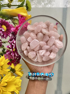 Small Tumbled Rose Quartz in a bowl. Rose Quartz helps us to manifest love in all of its forms: love of humanity, self-love, familial love, romantic love, etc. 