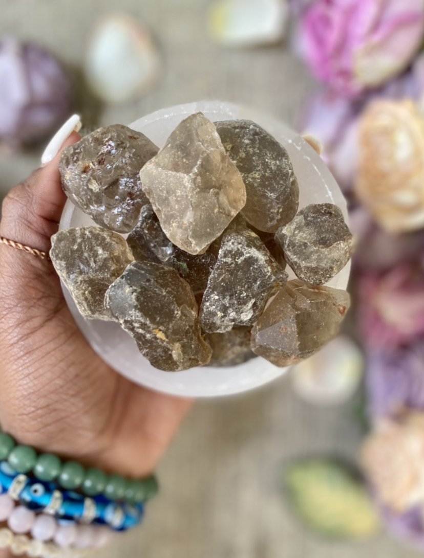 Smoky Quartz is a grounding stone. It helps to harmonize our bodies and souls so that we may focus on the present moment. It also helps in maintaining stability in emotions and feelings. Shop raw Smoky Quartz.