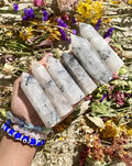 Tourmalinated Quartz is a combination of - you guessed it - Quartz and Tourmaline!  Tourmalinated Quartz activates the Root Chakra and helps us to feel grounded. It helps to harmonize our bodies and souls so that we may focus on the present moment. It also helps in maintaining stability in emotions and feelings.  Shop Tourmalinated Quartz Towers.