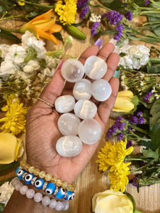 Selenite is a powerful cleansing and protective stone. Selenite cleanses other crystals, our auras, and our environments. Selenite (Satin Spar) tumbles pictured. 